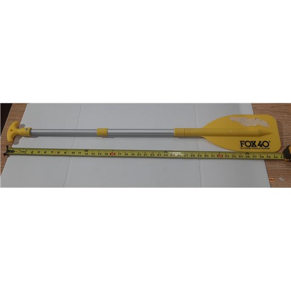 Fox 40 Telescopic Paddle featuring a bright yellow blade and an adjustable aluminum shaft.