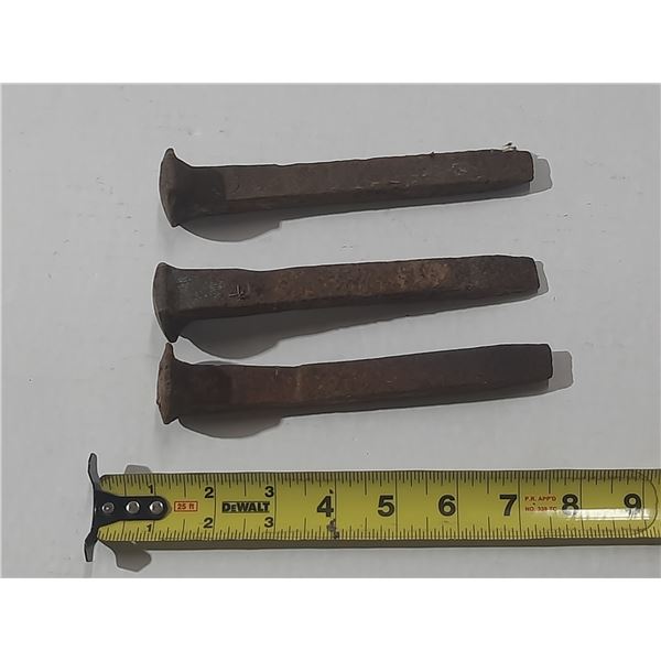 Vintage railway spikes, commonly used to fasten rail tracks to wooden ties.