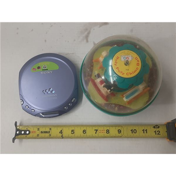 Vintage 1966 Fisher-Price #165 Roly Poly Chime Ball toy and blue Sony D-E220 Walkman is a portable C
