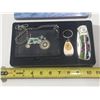 Image 2 : John Deere branded set includes a folding pocket knife with tractor artwork, a themed keychain, and 