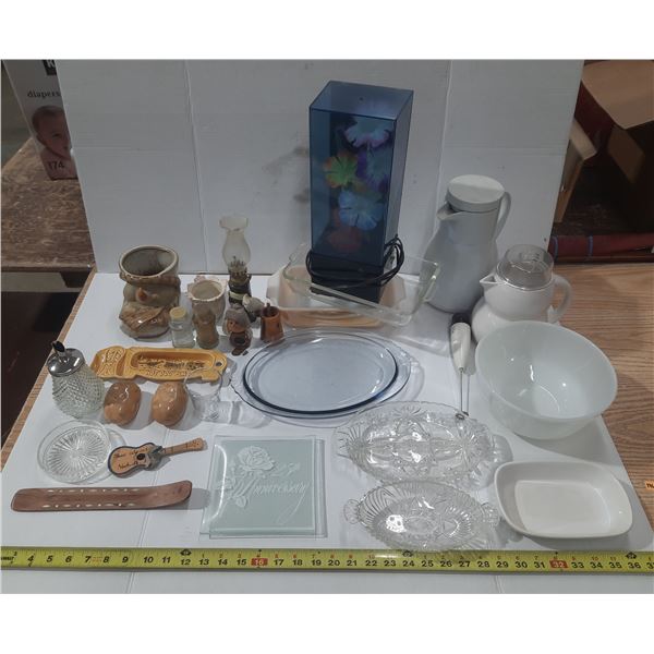 Variety of vintage household items, including clear pressed glass serving dishes, likely featuring f