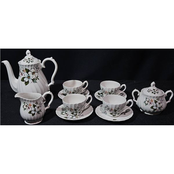 Complete China Tea Set with Floral Designs and 11 Pieces