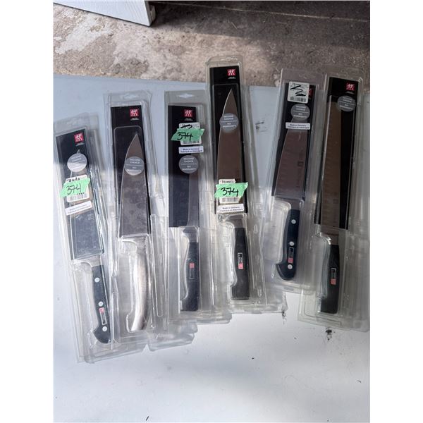 GROUP OF ZWILLING J.A. HENCKELS KITCHEN KNIVES IN PACKAGES