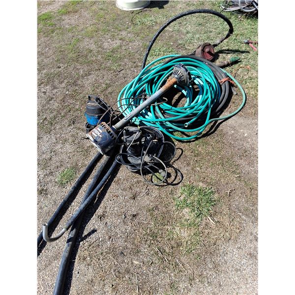 3 Bundle of Garden Hose,  PVC Pipe ,(3) Sump Pumps -Powers on