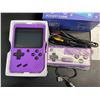 Image 2 : Handheld Retro Game Console w/ 3" Display - Loaded w/ 500 Classic Retro Games (Purple) - New