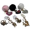 Image 1 : 7 New Glittery Keychains / Backpack Charms
