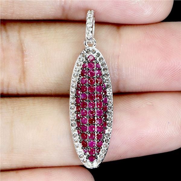 EXCEPTIONAL MYANMAR (BURMA)ROUND DIAMOND CUT RUBY AND WHITE SAPPHIRE PENDANT IN BLACK RHODIUM AND 14