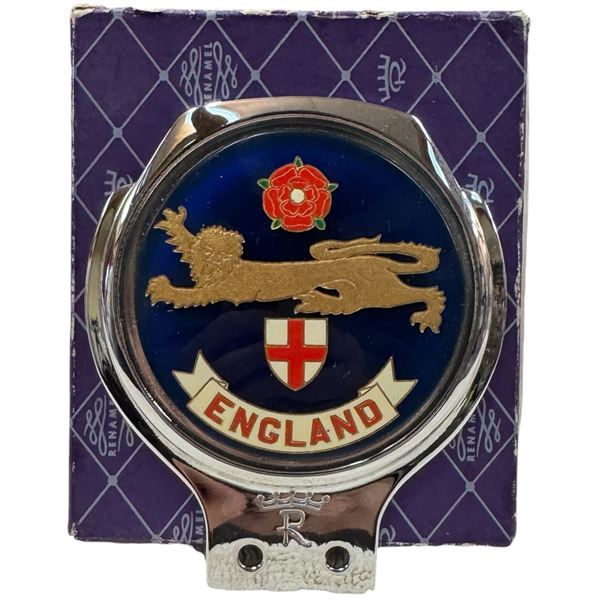 Renamel England Automobile Grille Badge Featuring a Blue Background, a Lion & and a Rose Shield.