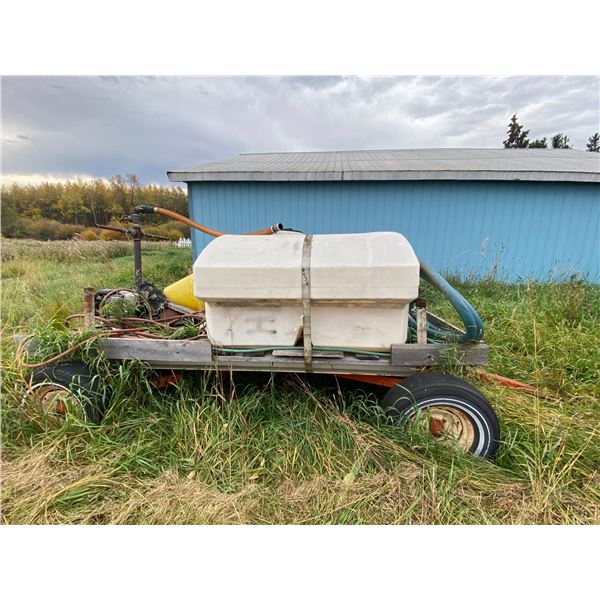 Poly tank c/w steel framed hayrack & gas water pump