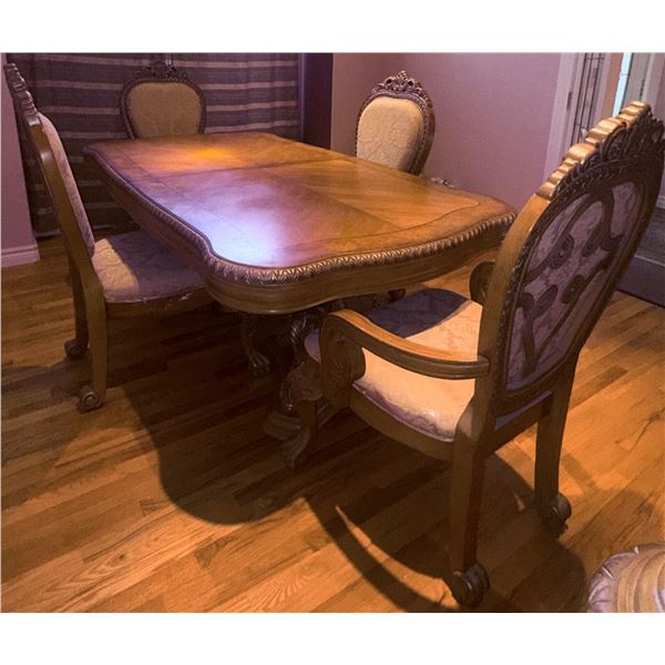 Carved Wood Dining Table With Ornate Pedestal Base and Six Upholstered Chairs