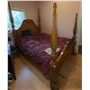Image 1 : Four-Poster Wooden Bed Frame With Ornate Carvings