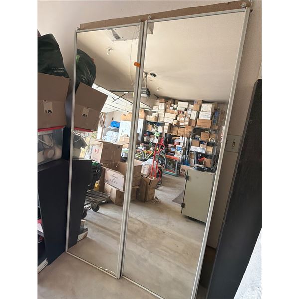 Framed Sliding Closet Mirror Doors with Visible Damage