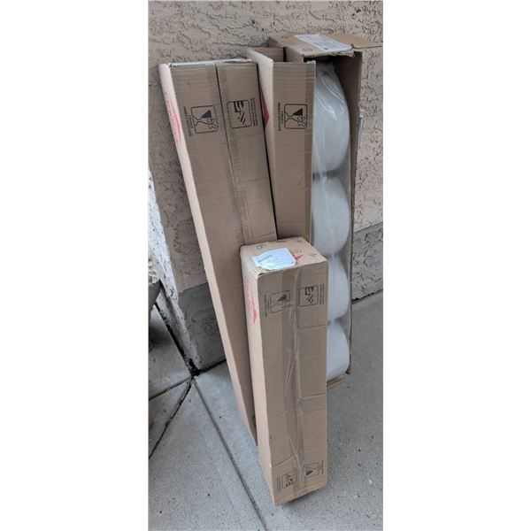 Three Boxes of United Lighting Products LED Light Fixtures