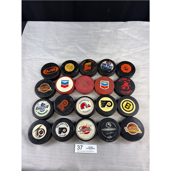 Lot of 21 Vintage Pucks 10 NHL and 11 Minor League/Chevron Vintage Pucks - 1 Chevron Puck Signed BY 