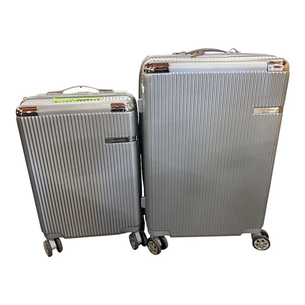 Group of 2 Champs Suitcases