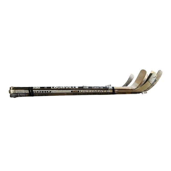 Group of 7 Hockey Sticks and 1 Skateboard