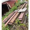 Image 3 : Group of Heavy-Duty Steel I-Beams and Industrial Pipes