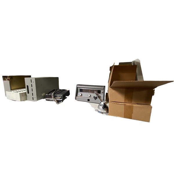 Shelf of Vintage Electronic Equipment, Metal Enclosures, and Panavise Tool