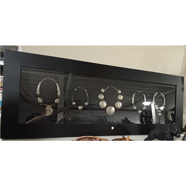 Framed Display of Tribal-Style Silver Statement Necklaces