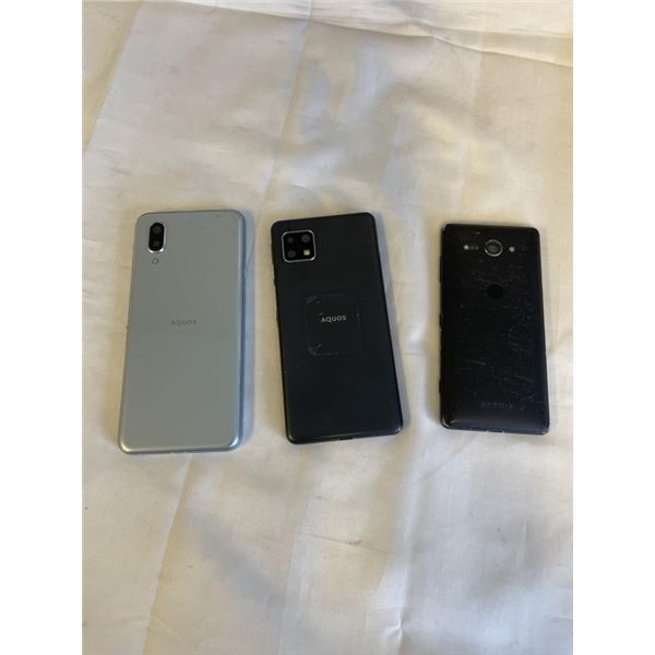 3 CELLPHONES INCLUDING AN XPERIA AND 2 AQUOS. ONE IS A SILVERSHARP AQUOS SENSE3 BASIC SHV48