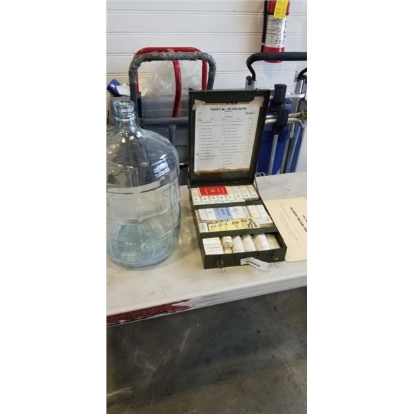 ANTIQUE FIRST AID KIT AND GLASS CARBOY