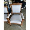 Image 2 : PAIR OF CARVED WOOD AND BLUE FABRIC CHAIRS W/ WHEELS