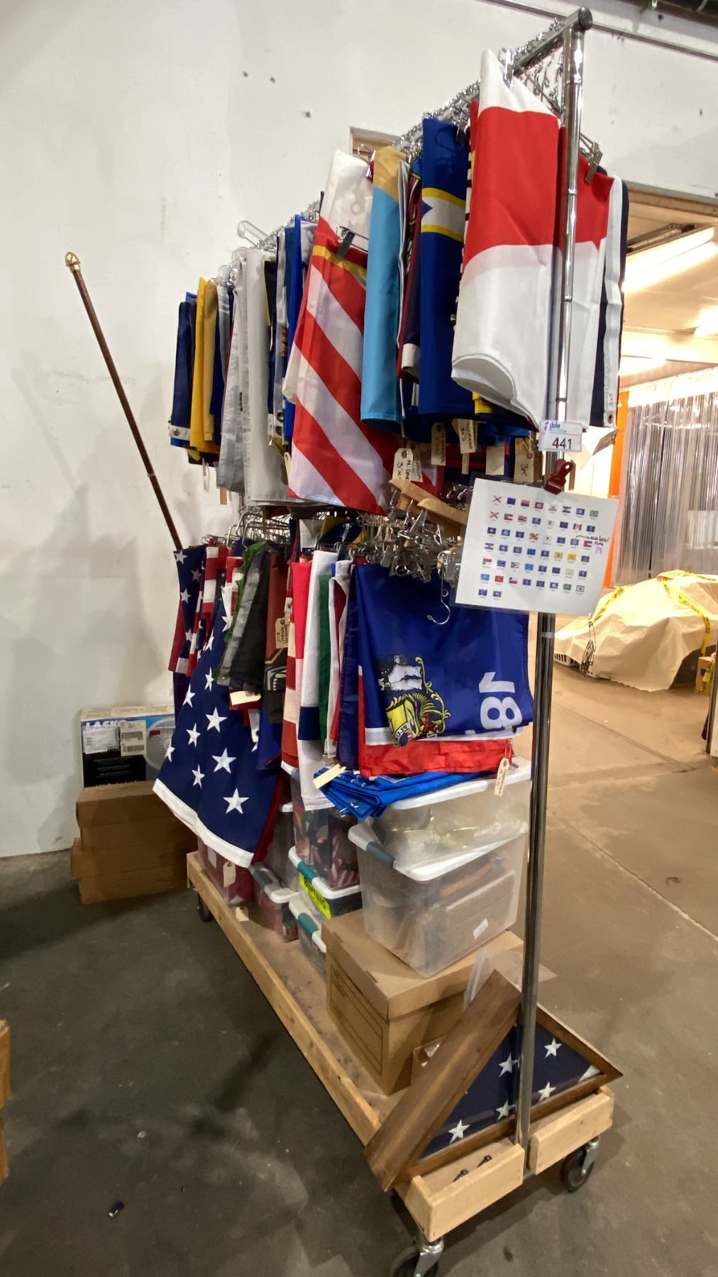 Large Rack For Flags GARMENT RACK WITH ASSORTED FLAGS AND FLAG POLES - Able Auctions