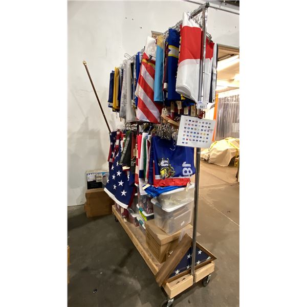 GARMENT RACK WITH ASSORTED FLAGS AND FLAG POLES