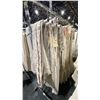 Image 1 : MOBILE CLOTHING RACK WITH ASSORTED SET DEC WARDROBE- ASSORTED DRAPES