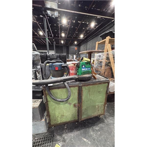 GREEN RUSTIC MOBILE SHOP CABINET WITH SHOP VAC, LEAF BLOWER, GAS CAN & SMALL WOOD TABLE