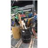 Image 1 : MOBILE RACK WITH ASSORTED TOOL BAGS & 2 BARRELS OF GARDEN TOOLS