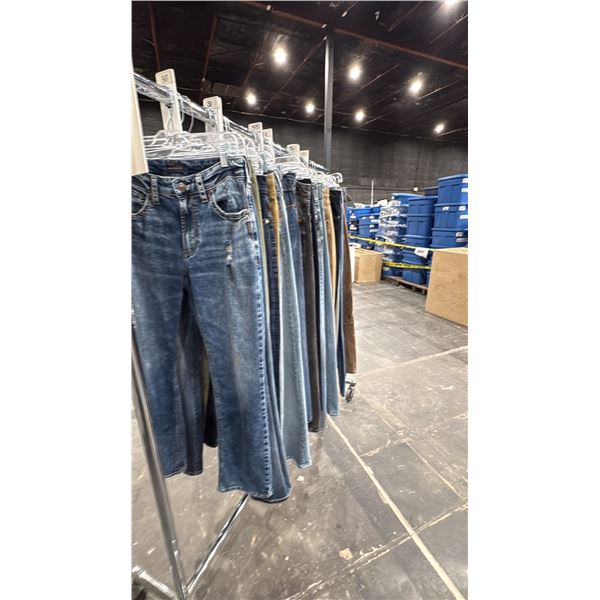 LARGE GROUP OF ASSORTED PRODUCTION COSTUME ITEMS- JEANS, JOGGERS & SWEATPANTS *RACK NOT INCLUDED*