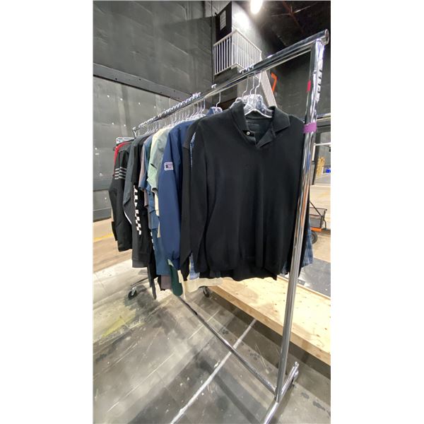 LARGE GROUP OF ASSORTED PRODUCTION COSTUME ITEMS- TSHIRTS, JACKETS, MOTOCROSS BIB PANTS