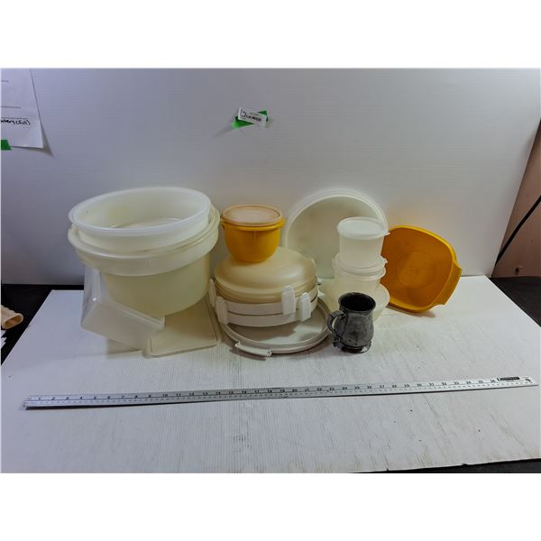 Assortment of Tupperware Containers and Metal Mug