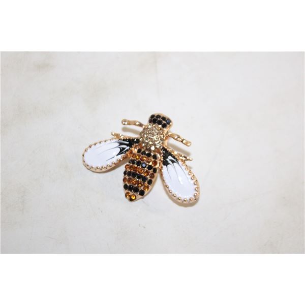 21)  GOLD TONE WITH BLACK & WHITE