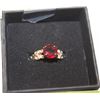 Image 1 : SZ.5 RUBY LIKE CENTER STONE WITH LEAF DETAIL RING
