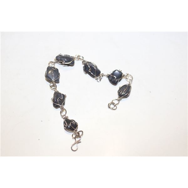 SILVER WIRE-WRAPPED BLACK ONYX BRACE.