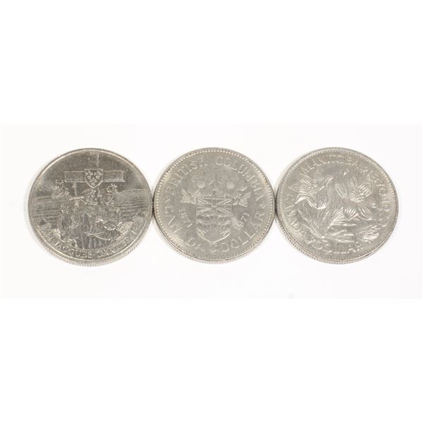 THREE CANADIAN DOLLAR COINS INCLUDING