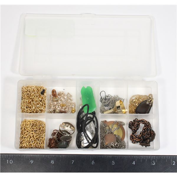 CLEAR PLASTIC STORAGE BOX WITH SOME JEWELRY ITEMS