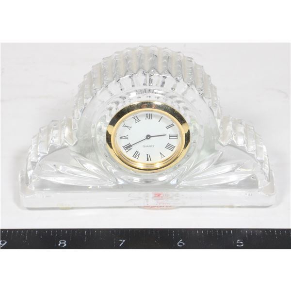 SMALL UNIQUE CLOCK LABEL READS "24% LEAD CRY"