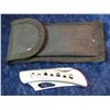 1504. 440 Stainless Steel Folding Knife with nylon sheath.