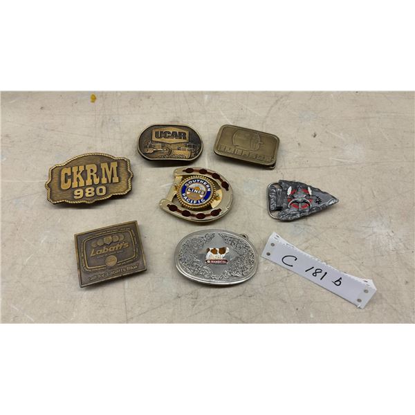 Collection of Seven Vintage Belt Buckles Including CKRM 980, Labatt's, and More