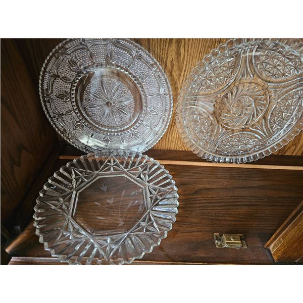 Three Intricately Cut Glass Plates with Geometric and Floral Designs