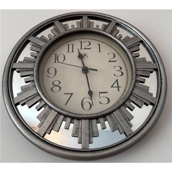 Wall Clock with Sunburst Design and Decorative Table Lamp