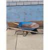 Image 2 : Blue Metal Wheelbarrow with Rust and Signs of Wear