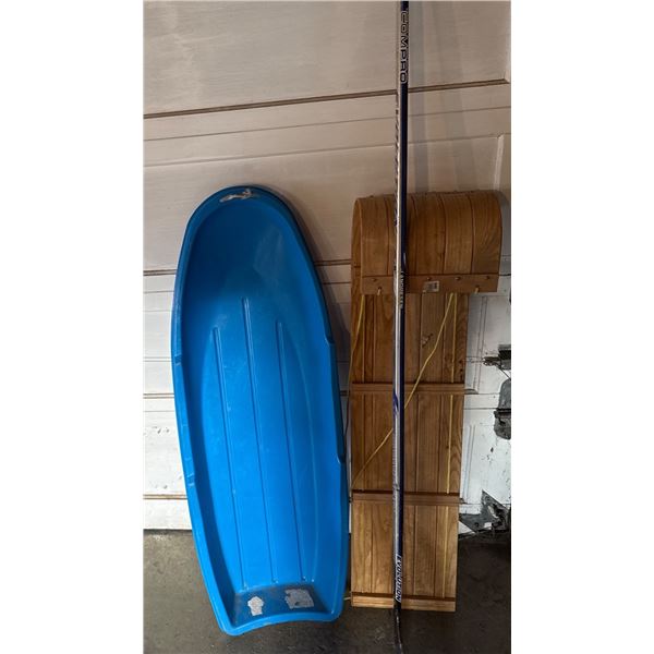 Blue Plastic Toboggan, Wooden Toboggan, and Ski Pole