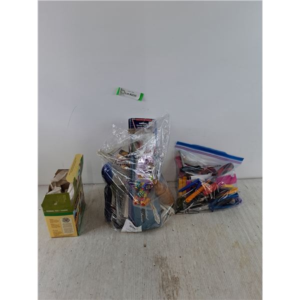 Cat Toys, Opened Herbal Tea Pack, Bag of Pencils and Tools