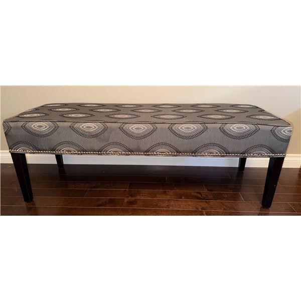 Upholstered Gray Bench With Decorative Pattern and Dark Wooden Legs