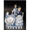 Image 1 : Porcelain Figurine Clock with Romantic Couple and Tea Set Design