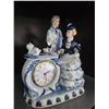 Image 2 : Porcelain Figurine Clock with Romantic Couple and Tea Set Design